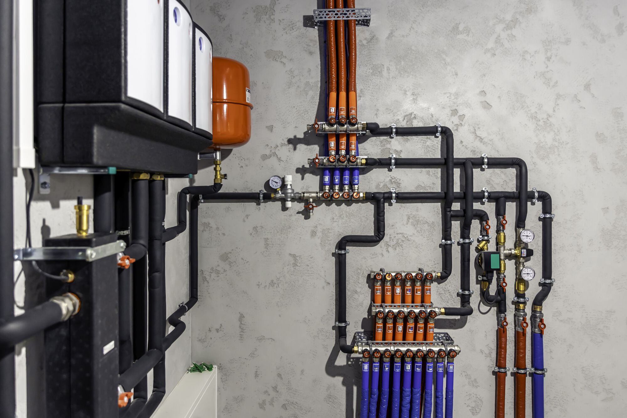 Boilers and heating pipework in a plant room (stock photo, to be replaced with a Dalex project photo)